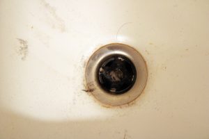 shower drain clogged with hairs