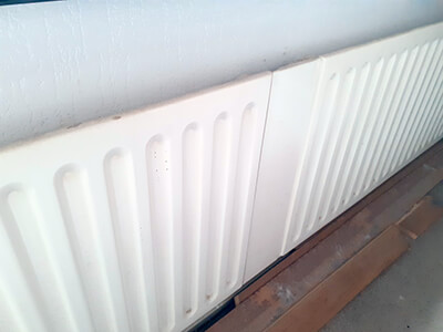 Removing an old radiator during replacement