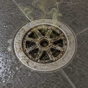a clogged shower drain can cause unpleasant smells