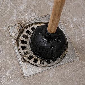 A plunger can help to unblock a shower drain